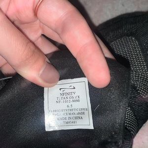 Pair of Black NFINITY cheer shoes size 6.5.